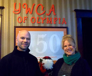 Board member presenting a check to the YMCA of Olympia